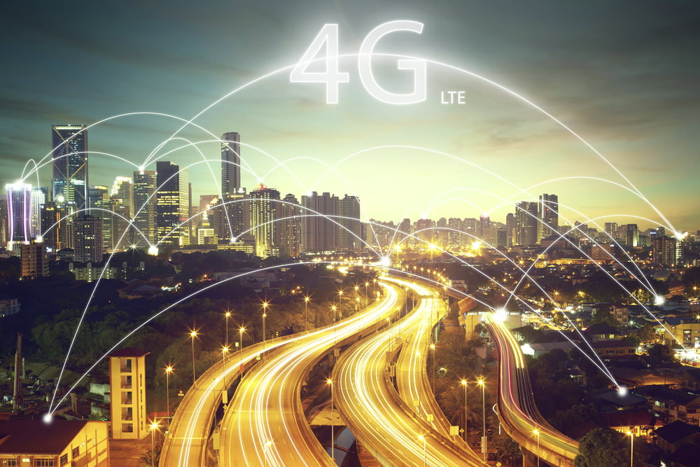 Nighttime cityscape with highways and 4G graphics overlaid